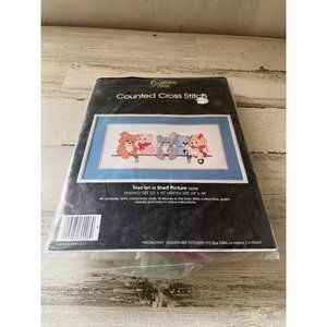 Golden Bee Counted Cross Stitch Toys on a Shelf